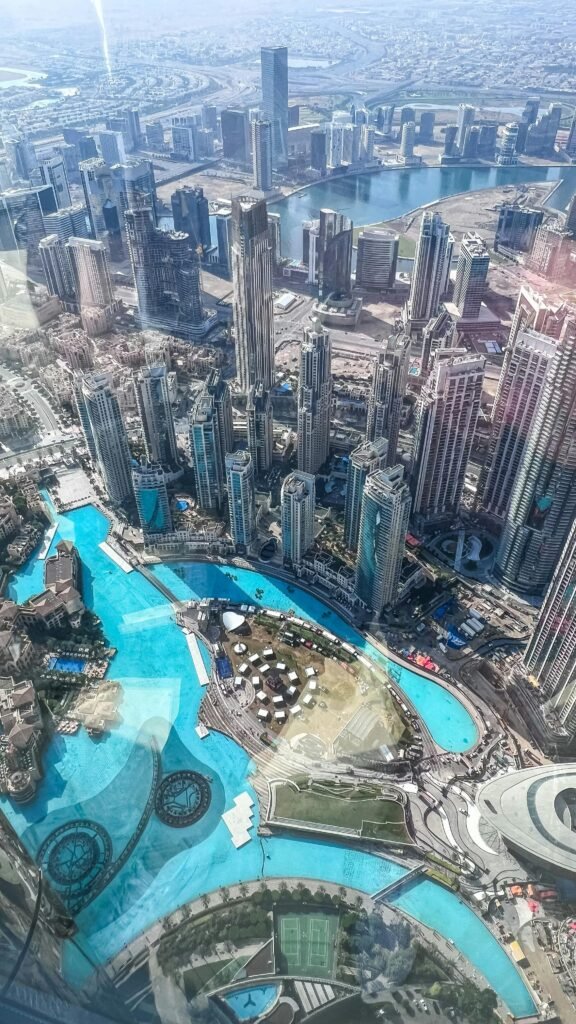 Stunning aerial view of Dubai's skyline with Burj Khalifa and cityscape under bright daylight.